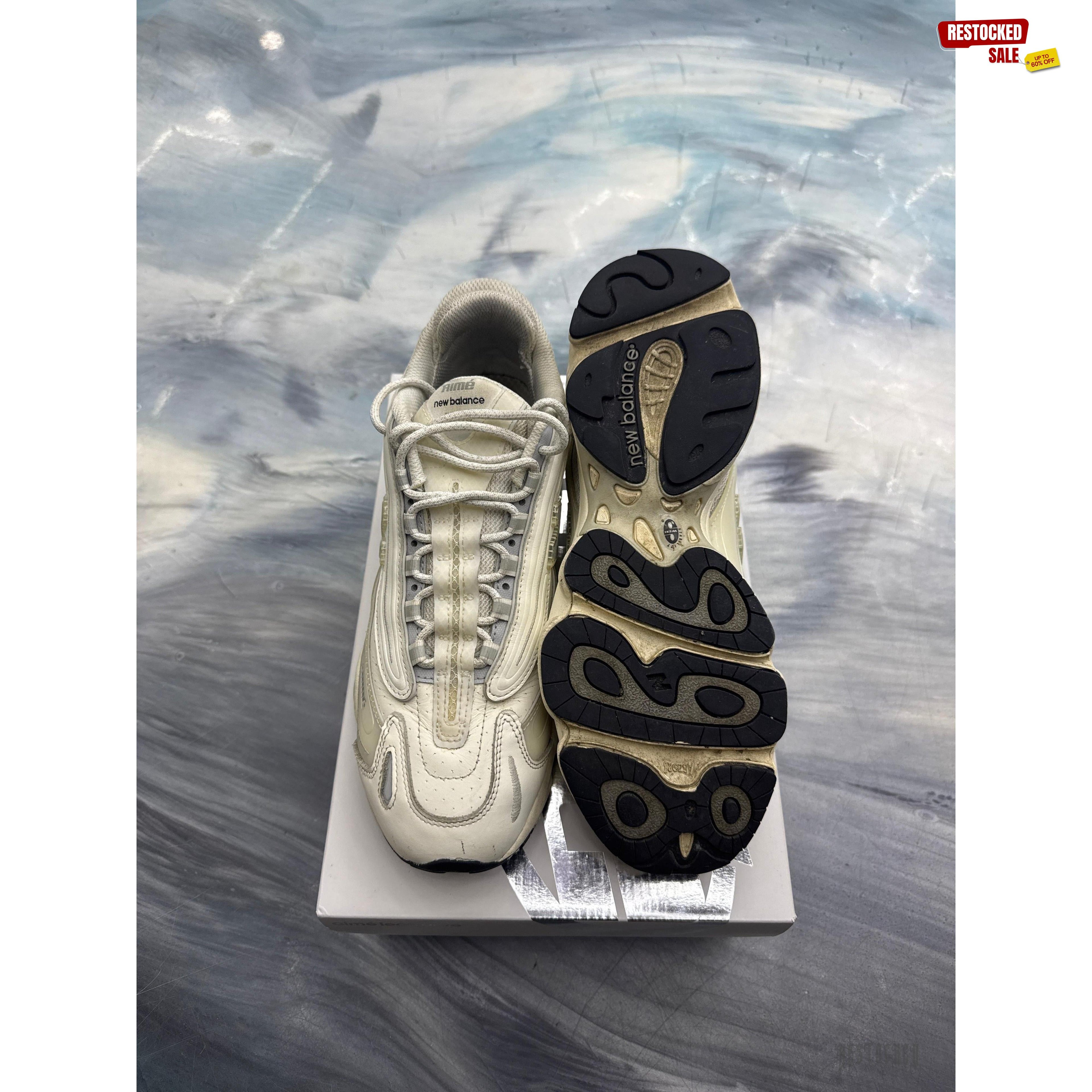 New Balance 1000 Aime Leon Dore white pre-owned size 10.5 sneakers, top and sole view.