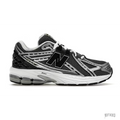 New Balance 1906R GS sneaker in silver metallic and black mesh with white laces and N-ergy sole.