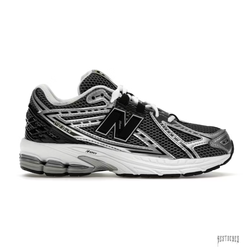 New Balance 1906R GS sneaker in silver metallic and black mesh with white laces and N-ergy sole.
