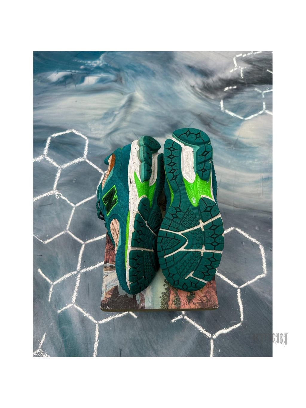 New Balance 2002R Salehe Bembury "Water Be The Guide" sneakers, size 8.5, with teal suede and mesh, orange accents, and green soles.