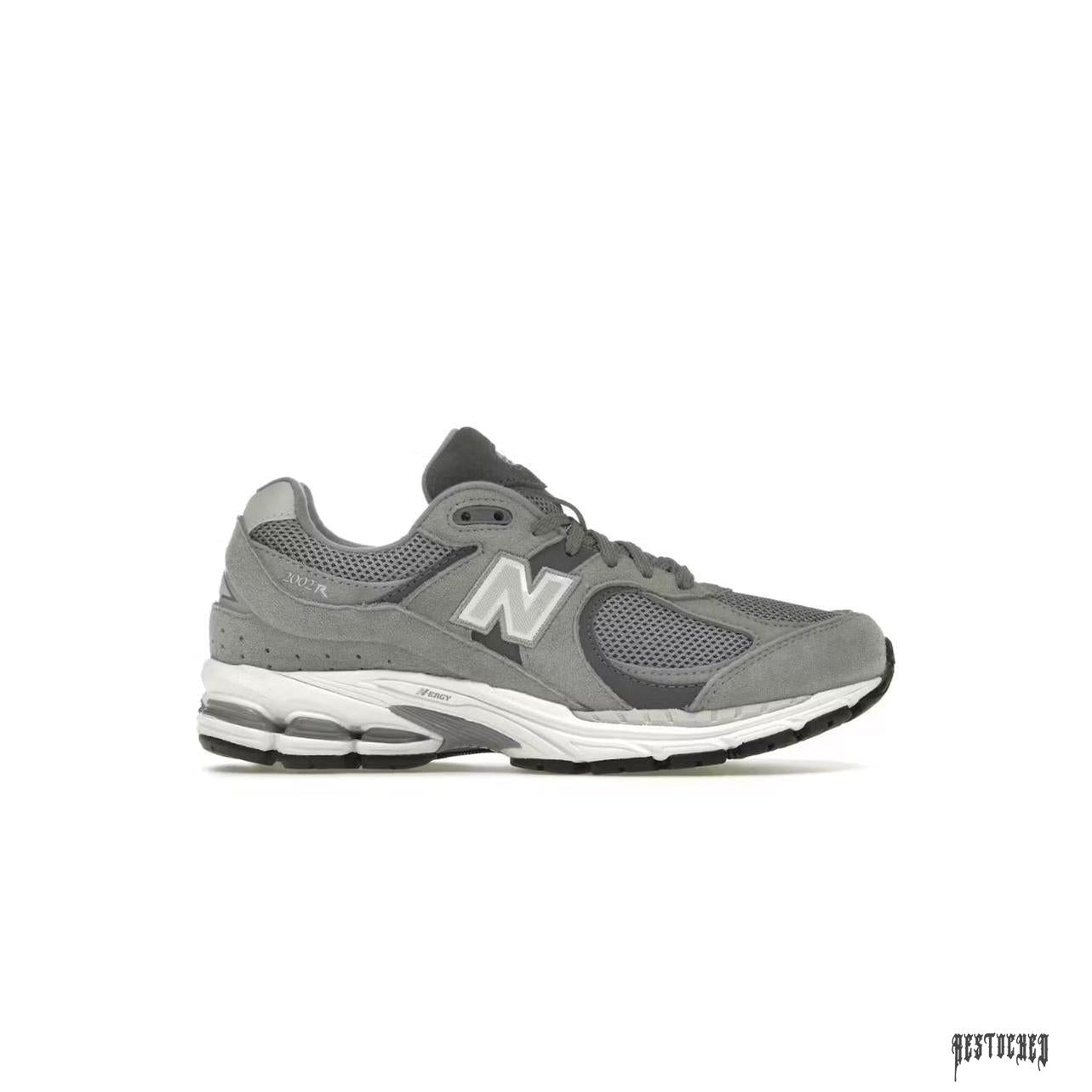 New Balance 2002R Steel Grey Orca sneakers with suede and mesh upper, white midsole, and black outsole.