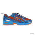 New Balance 740V2 Amine Benson Tech sneaker in vibrant blue and orange mesh with toggle laces and ABZORB sole.
