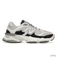 New Balance 9060 Grey Jet Black sneaker with mesh and suede accents, chunky white and grey sole.