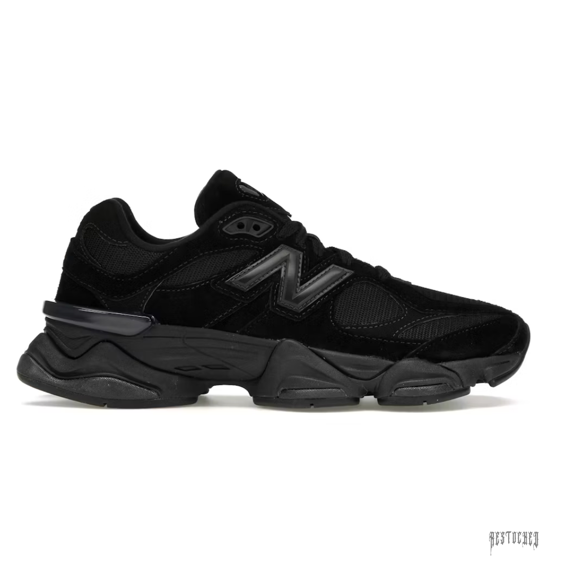 New Balance 9060 Triple Black sneaker with black suede and mesh upper, prominent black N logo, and chunky black sole.