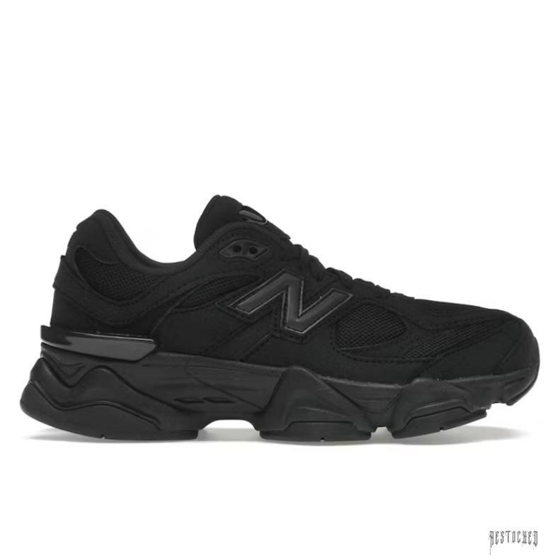 New Balance Triple Black 9060 (GS) sneaker, featuring a sleek all-black design with mesh and suede materials.