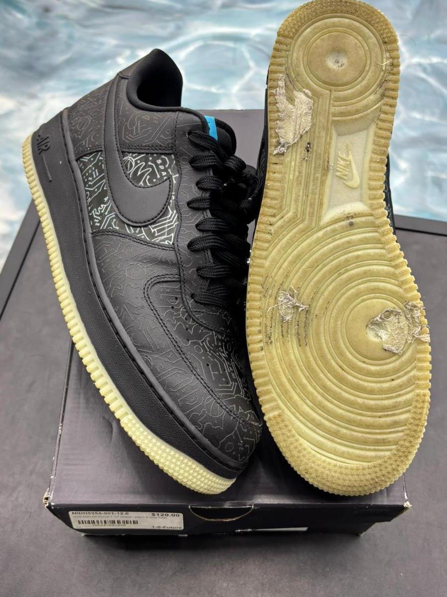 Pre-owned black Nike Air Force 1 Low Computer Chip Space Jam sneakers, size 12, with glow soles.