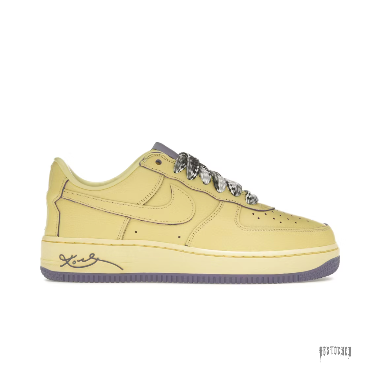 NIKE AIR FORCE 1 LOW PROTO KOBE BRYANT Mamba Mentality sneaker in pale yellow leather with purple accents and patterned laces.