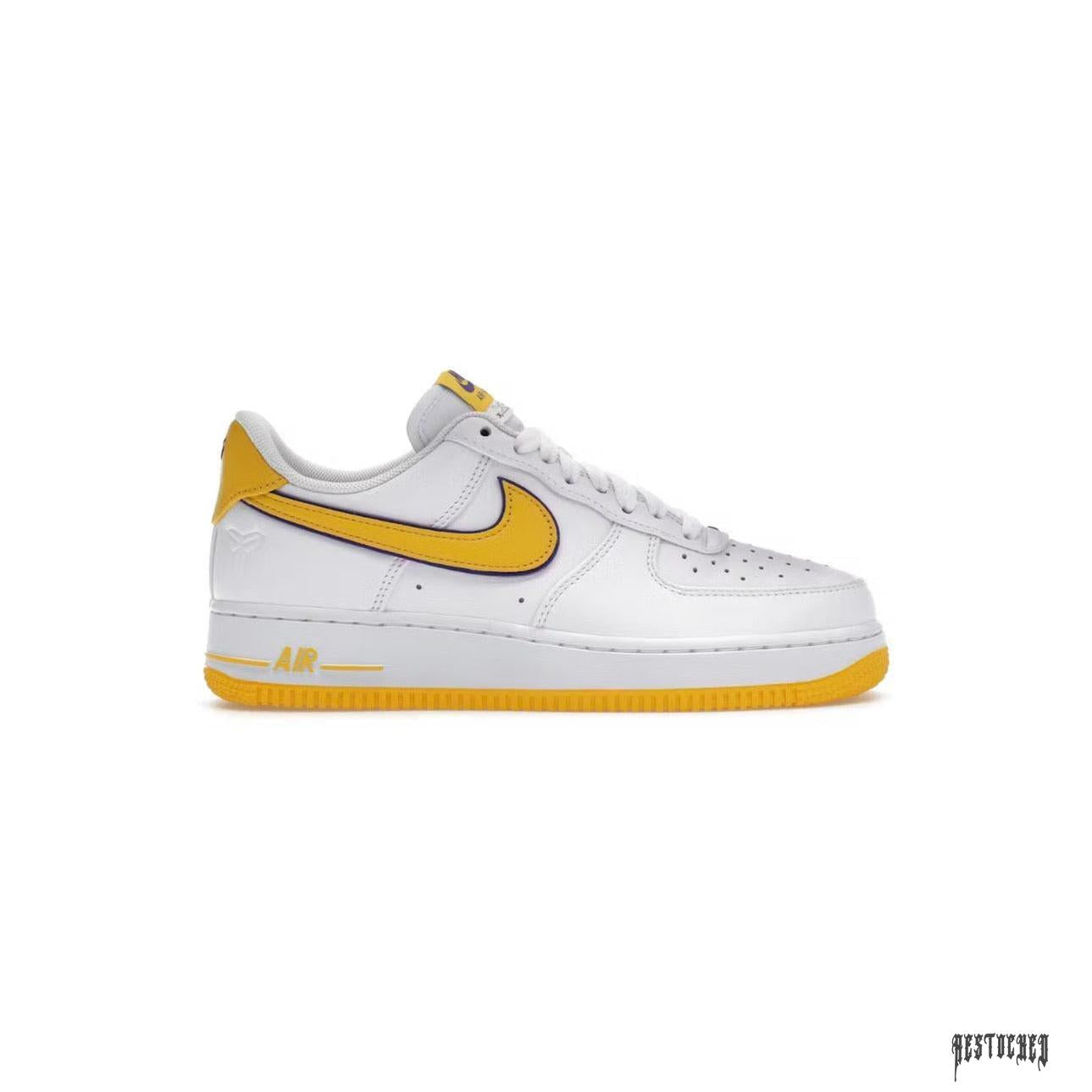 NIKE AIR FORCE 1 LOW KOBE BRYANT LAKERS HOME: White leather sneaker with yellow swoosh, heel, and sole.
