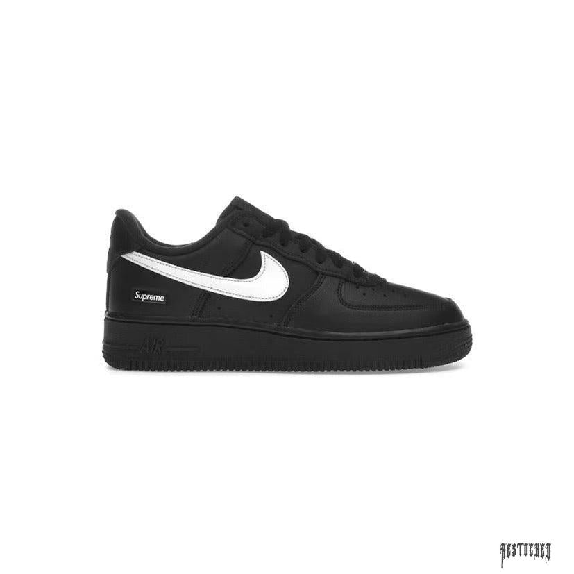 NIKE AIR FORCE 1 LOW SUPREME BLACK WHITE sneaker with white swoosh and Supreme branding.