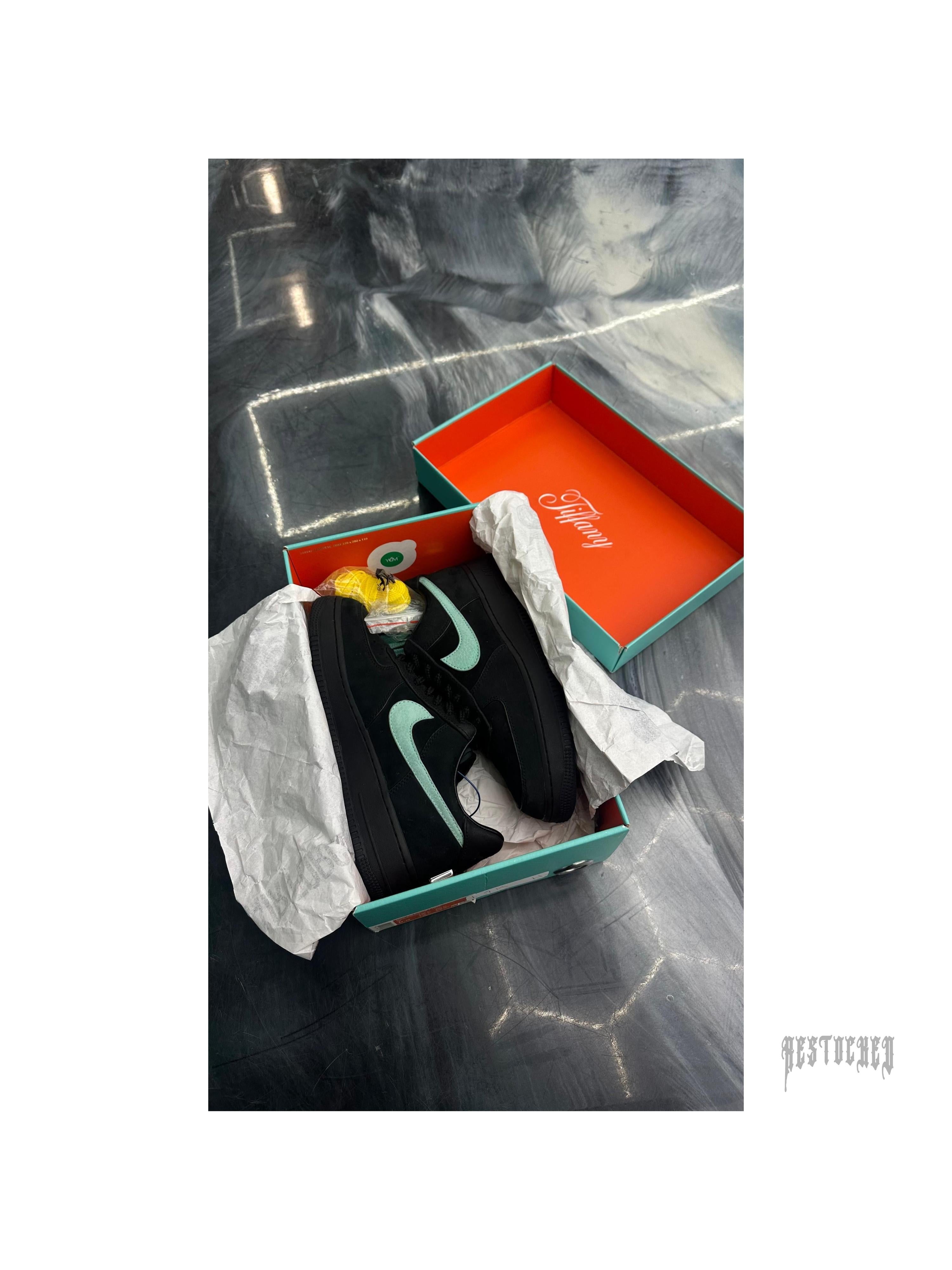 Pre-owned Nike Air Force 1 Low Tiffany & Co. 1837 sneakers, size 7, black with Tiffany blue swoosh, in original box.