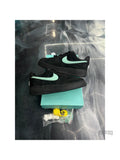 Pre-owned NIKE AIR FORCE 1 LOW TIFFANY & CO. 1837 sneakers, size 7, black suede with Tiffany blue swoosh, on a matching box.