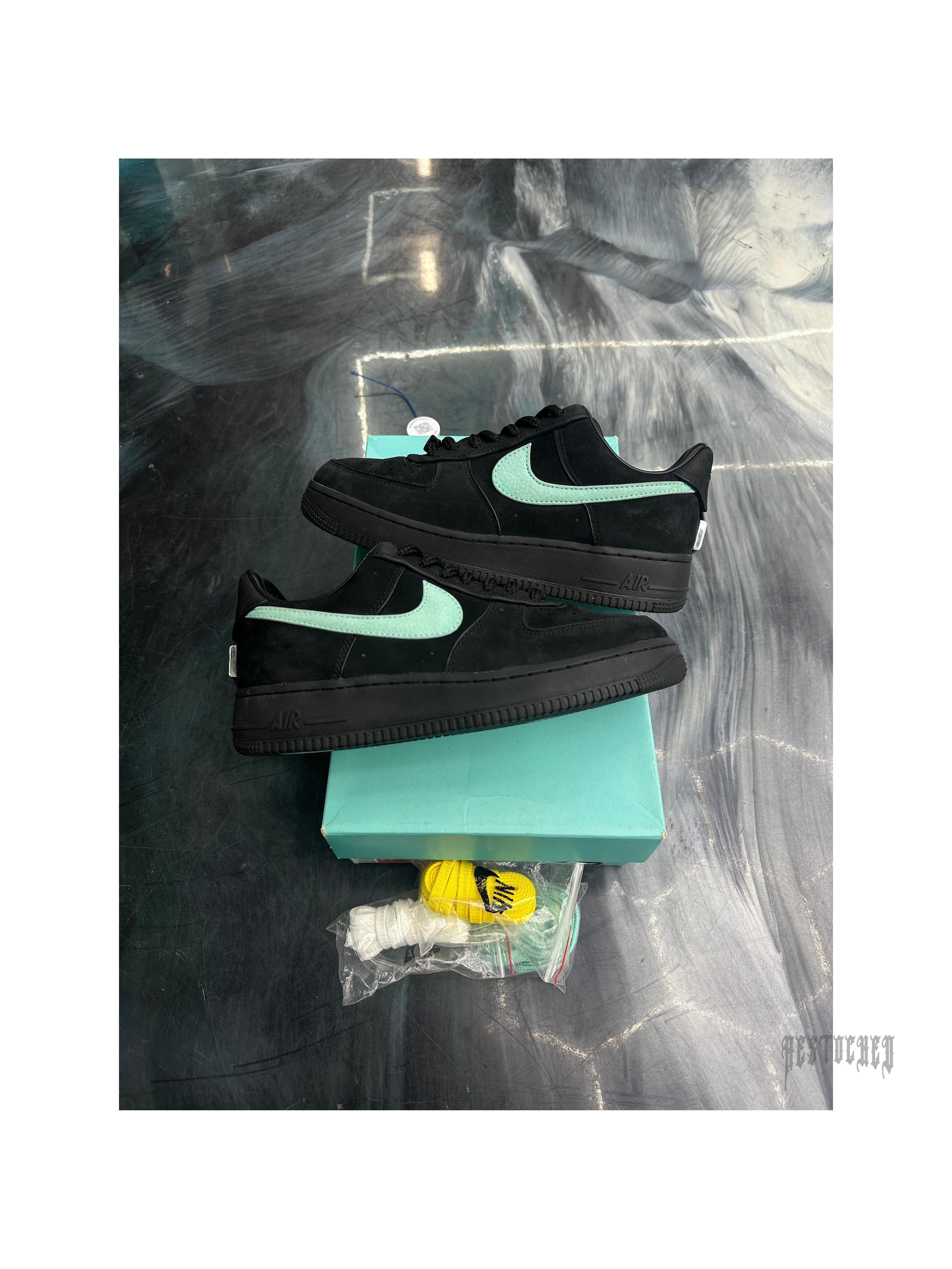 Pre-owned NIKE AIR FORCE 1 LOW TIFFANY & CO. 1837 sneakers, size 7, black suede with Tiffany blue swoosh, on a matching box.