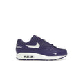 NIKE AIR MAX 1 '87 SP Supreme Varsity Purple sneaker with white swoosh and "Famous" script.