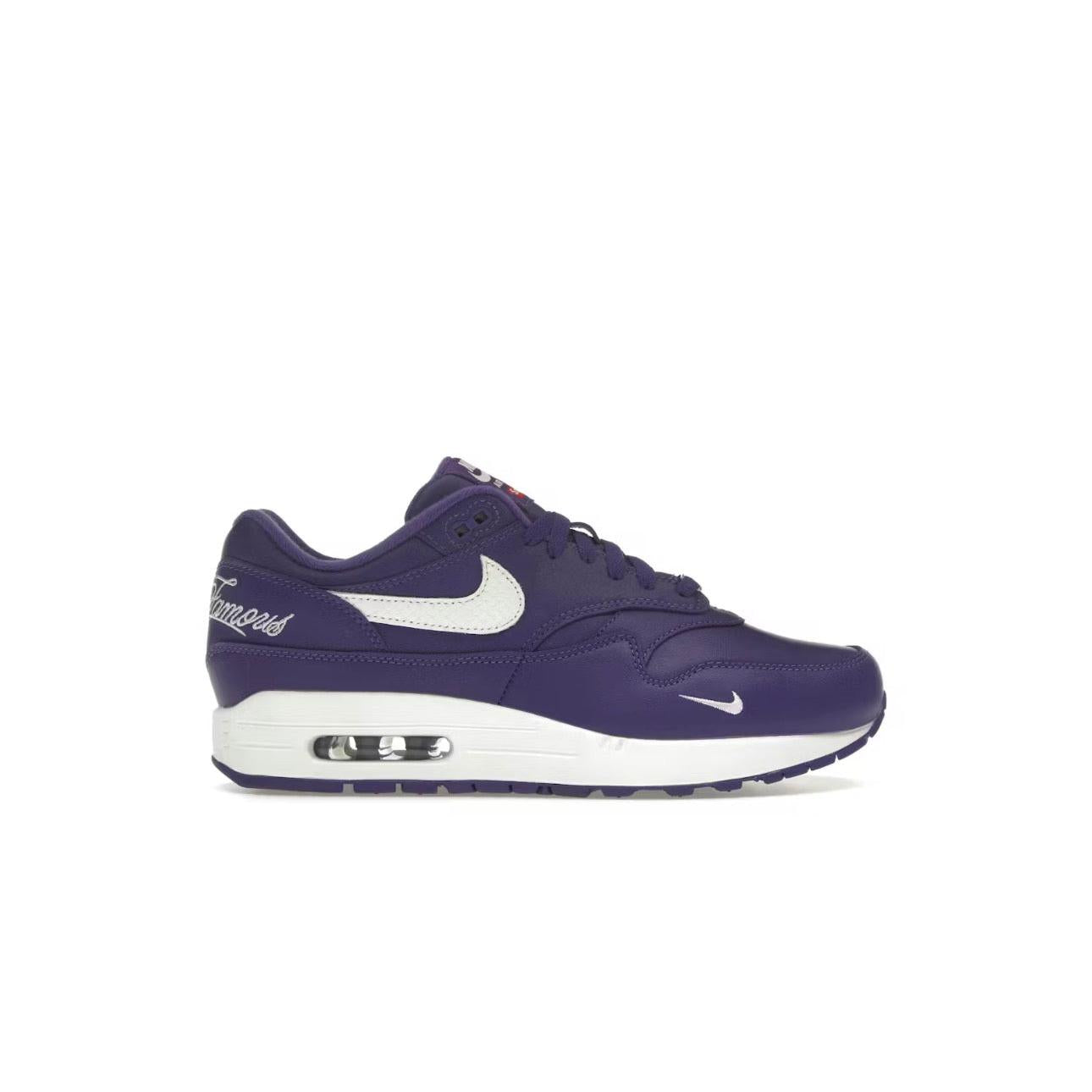 NIKE AIR MAX 1 '87 SP Supreme Varsity Purple sneaker with white swoosh and "Famous" script.