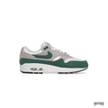 NIKE AIR MAX 1 ANNIVERSARY GREEN sneaker with grey and white mesh, green suede mudguard, and visible Air unit.