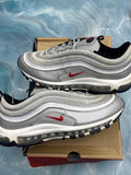 Pair of pre-owned Nike Air Max 97 Silver Bullet sneakers, size 11, with metallic silver uppers and red swoosh.