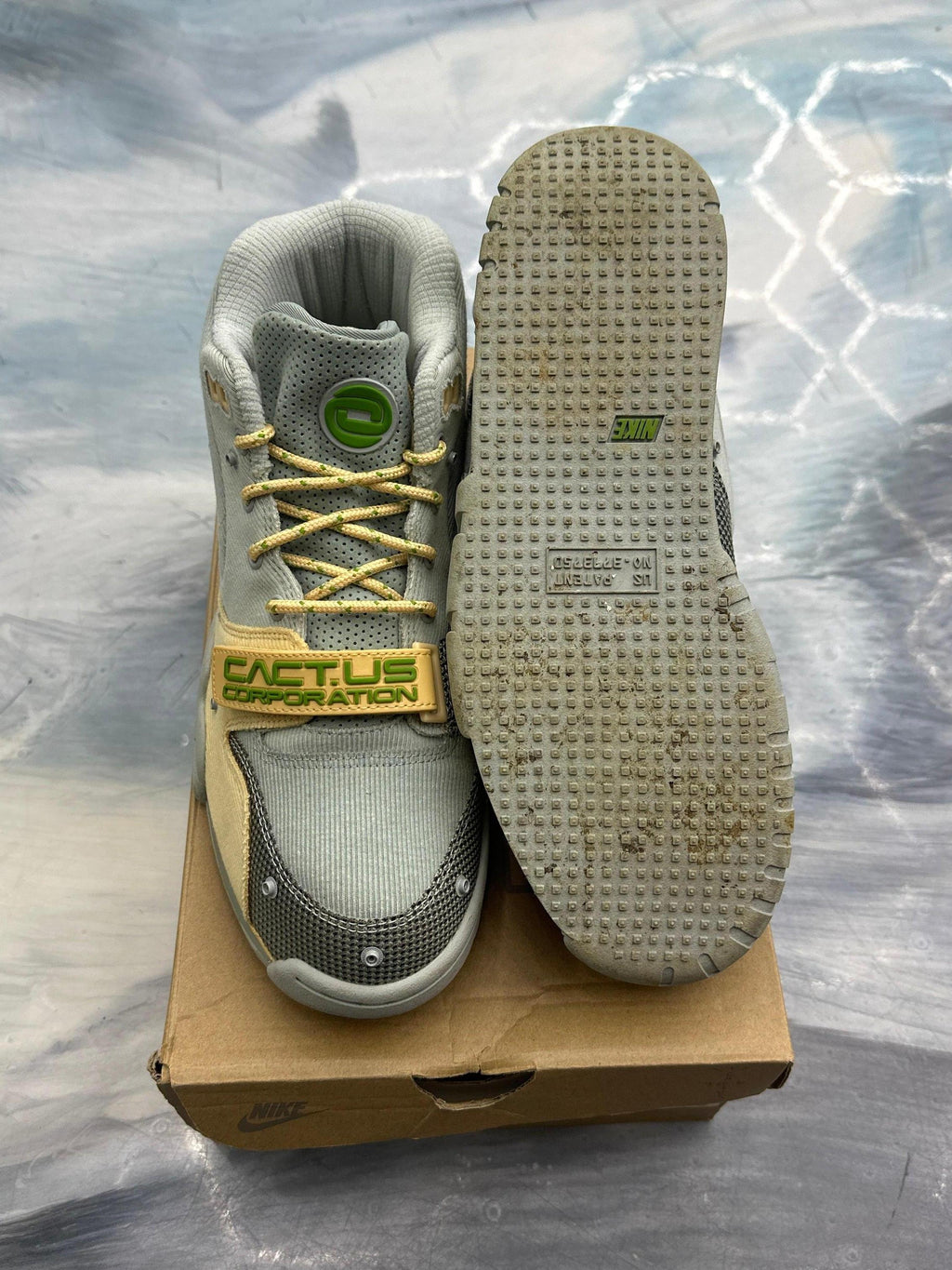 Travis Scott Nike Air Trainer 1 SP Grey Haze pre-owned size 9, with "CACT.US CORPORATION" strap.
