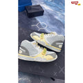 NIKE AIR TRAINER 1 SP Travis Scott Grey Haze pre-owned size 9.5 sneakers with yellow accents.