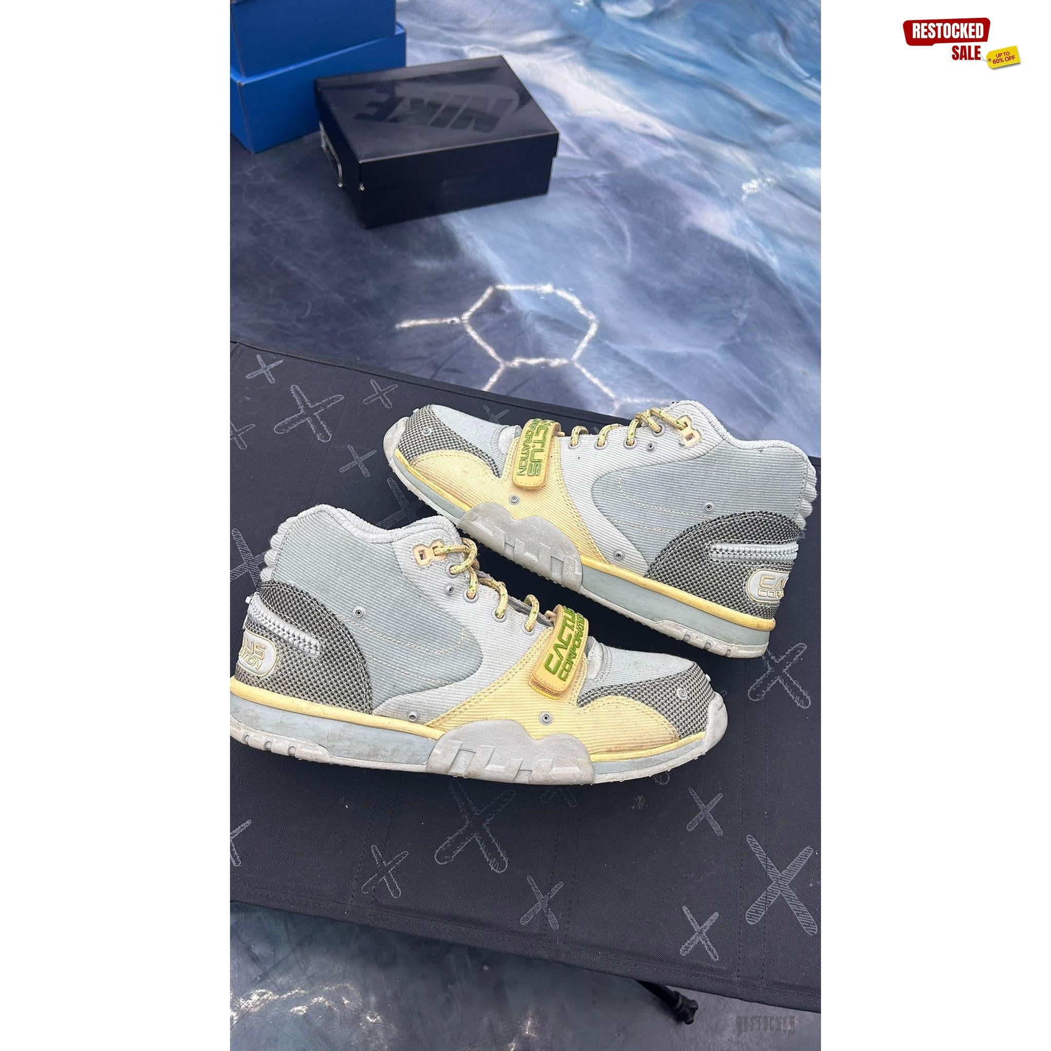 NIKE AIR TRAINER 1 SP Travis Scott Grey Haze pre-owned size 9.5 sneakers with yellow accents.