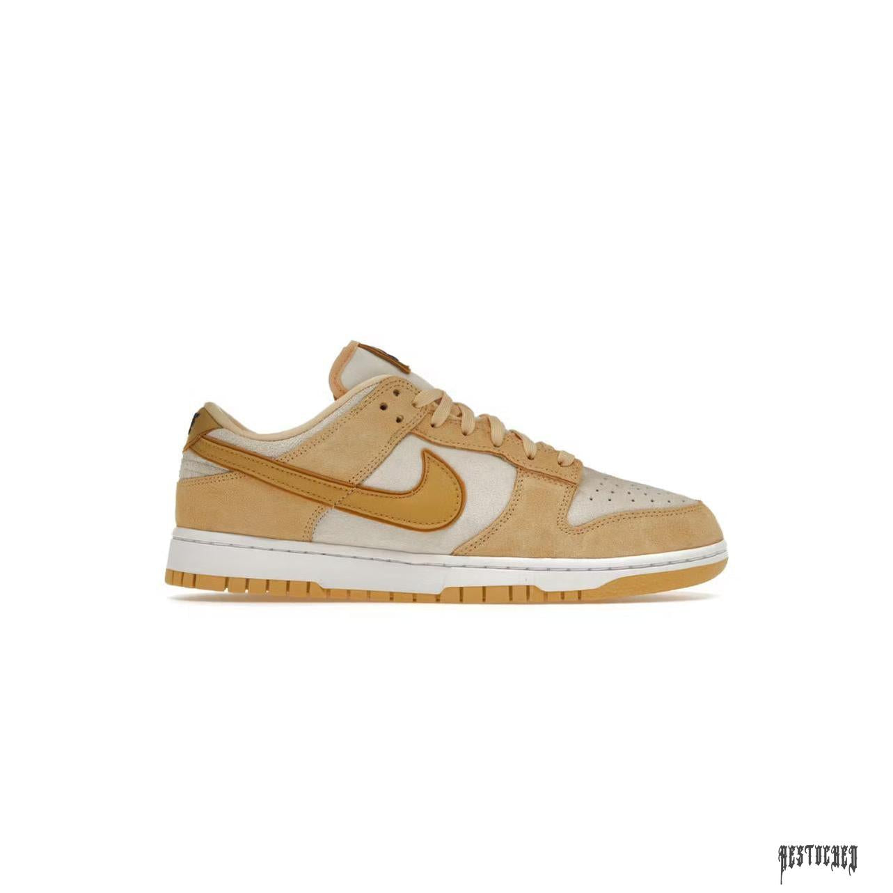 Women's Nike Dunk Low Celestial Gold Suede sneaker, tan and gold with white sole.