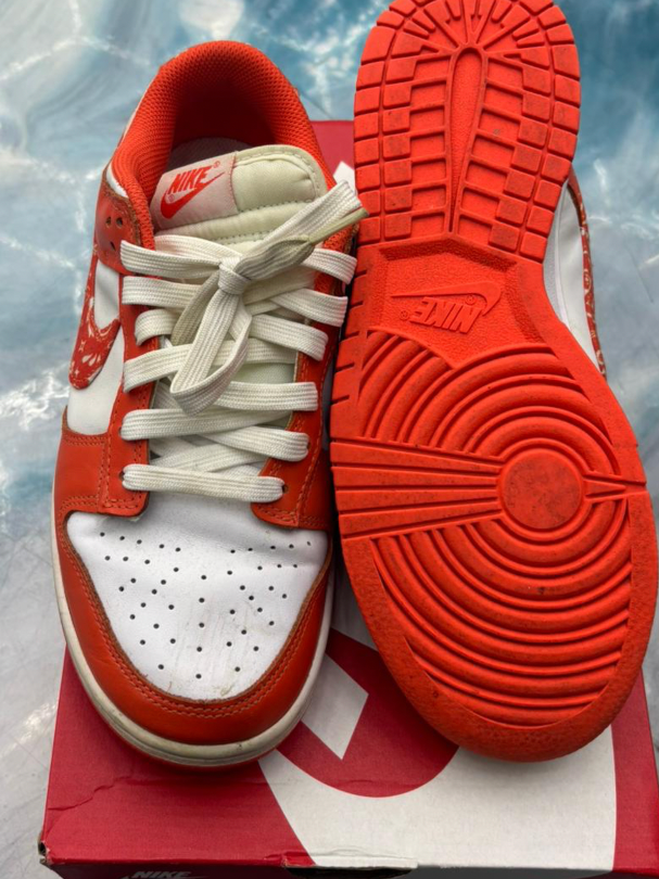 Pre-owned Nike Dunk Low Essential Paisley Pack Orange sneakers, size 8.5W/7M, showing orange and white leather with paisley accents and orange sole.