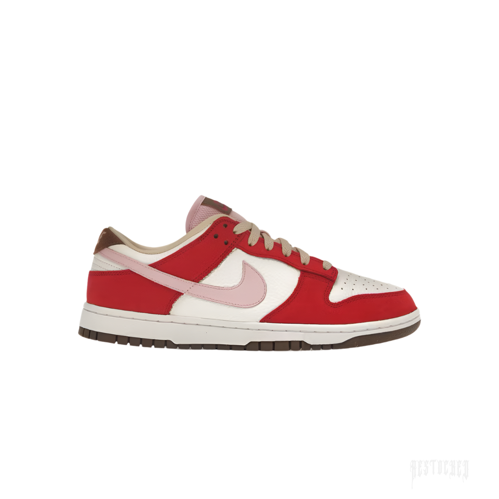 NIKE DUNK LOW PRM BACON women's sneaker with red suede, sail leather, pink swoosh, and brown outsole.