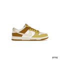 NIKE DUNK LOW RETRO BRONZINE sneaker with white, bronze, and yellow leather panels.