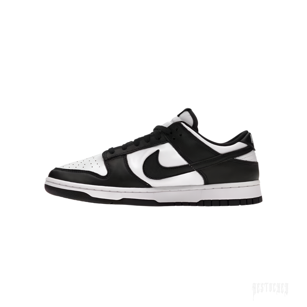 NIKE DUNK LOW RETRO Panda sneakers in white and black leather with classic Swoosh.