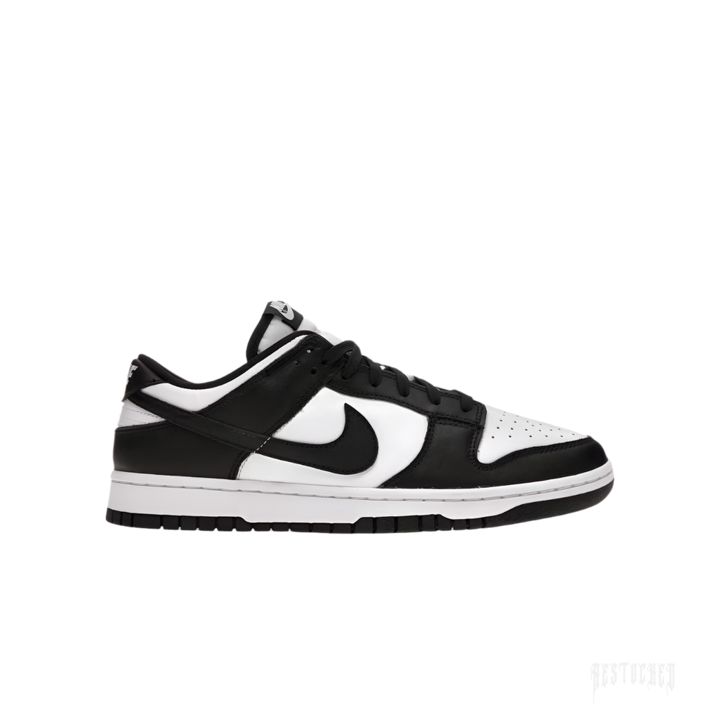 NIKE DUNK LOW RETRO Panda sneakers in white and black leather, side view.