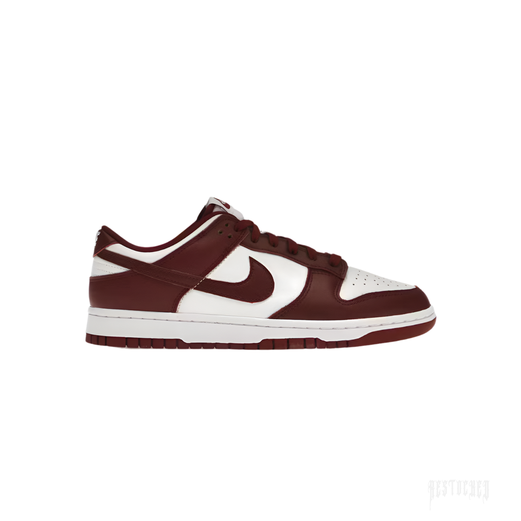 NIKE DUNK LOW TEAM RED sneakers, featuring a white leather base with deep red overlays and a white Swoosh.