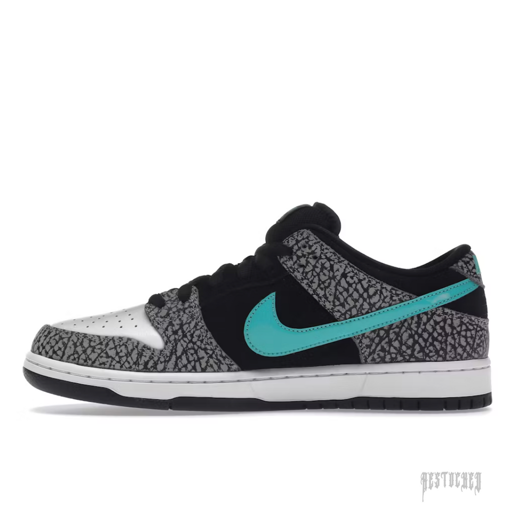 NIKE SB Dunk Low Atmos Elephant sneaker with black suede, grey elephant print, white toe box, and turquoise swoosh.