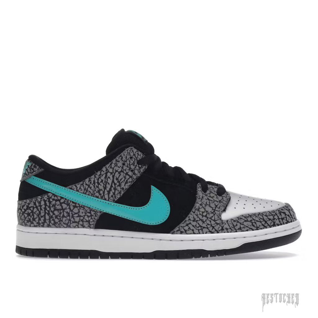 NIKE SB DUNK LOW ATMOS ELEPHANT sneaker with black, grey elephant print, white toe, and teal swoosh.