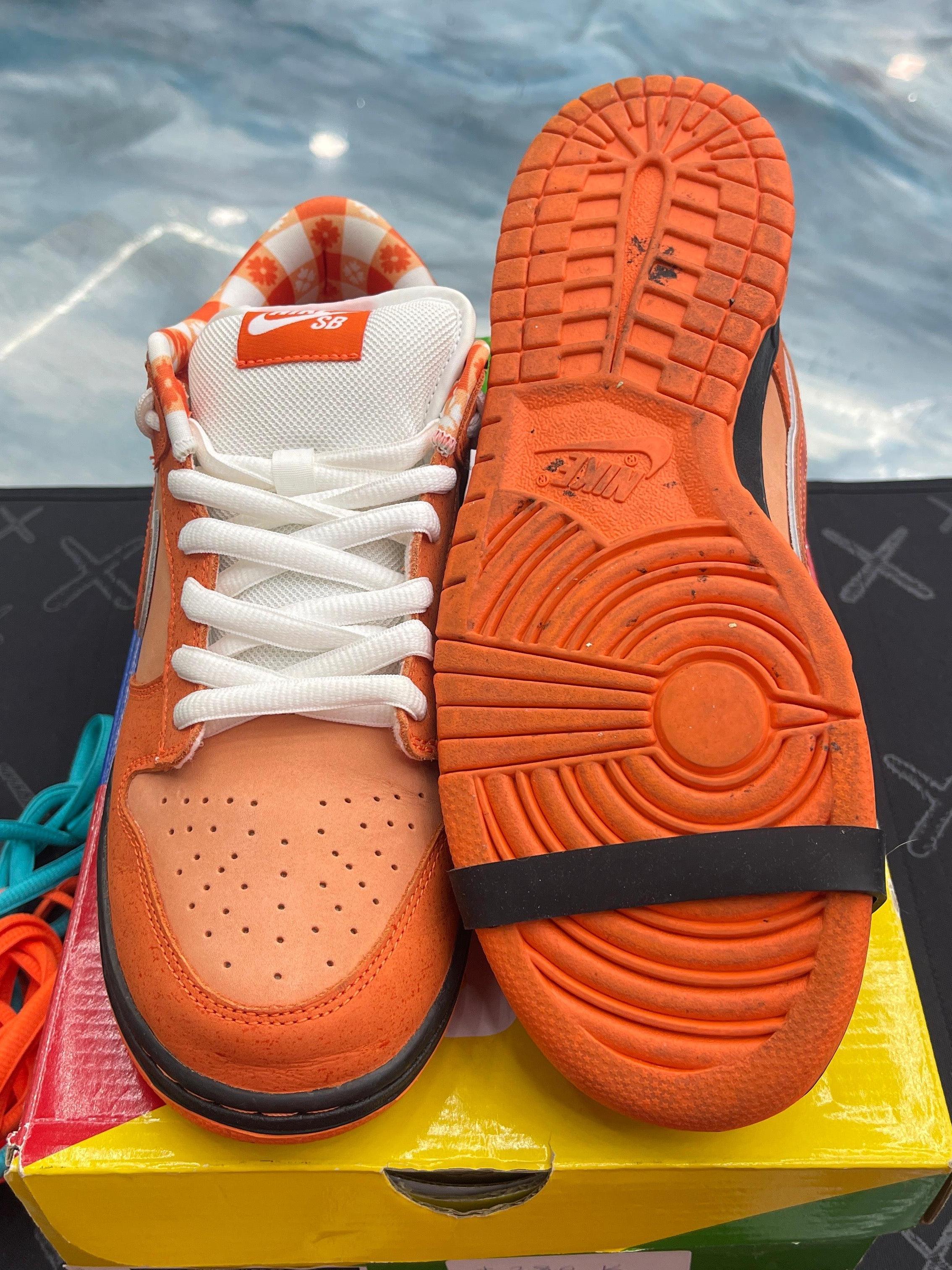 Pre-owned Nike SB Dunk Low Concepts Orange Lobster sneakers, size 9.5, showing orange suede, white laces, and orange outsole.