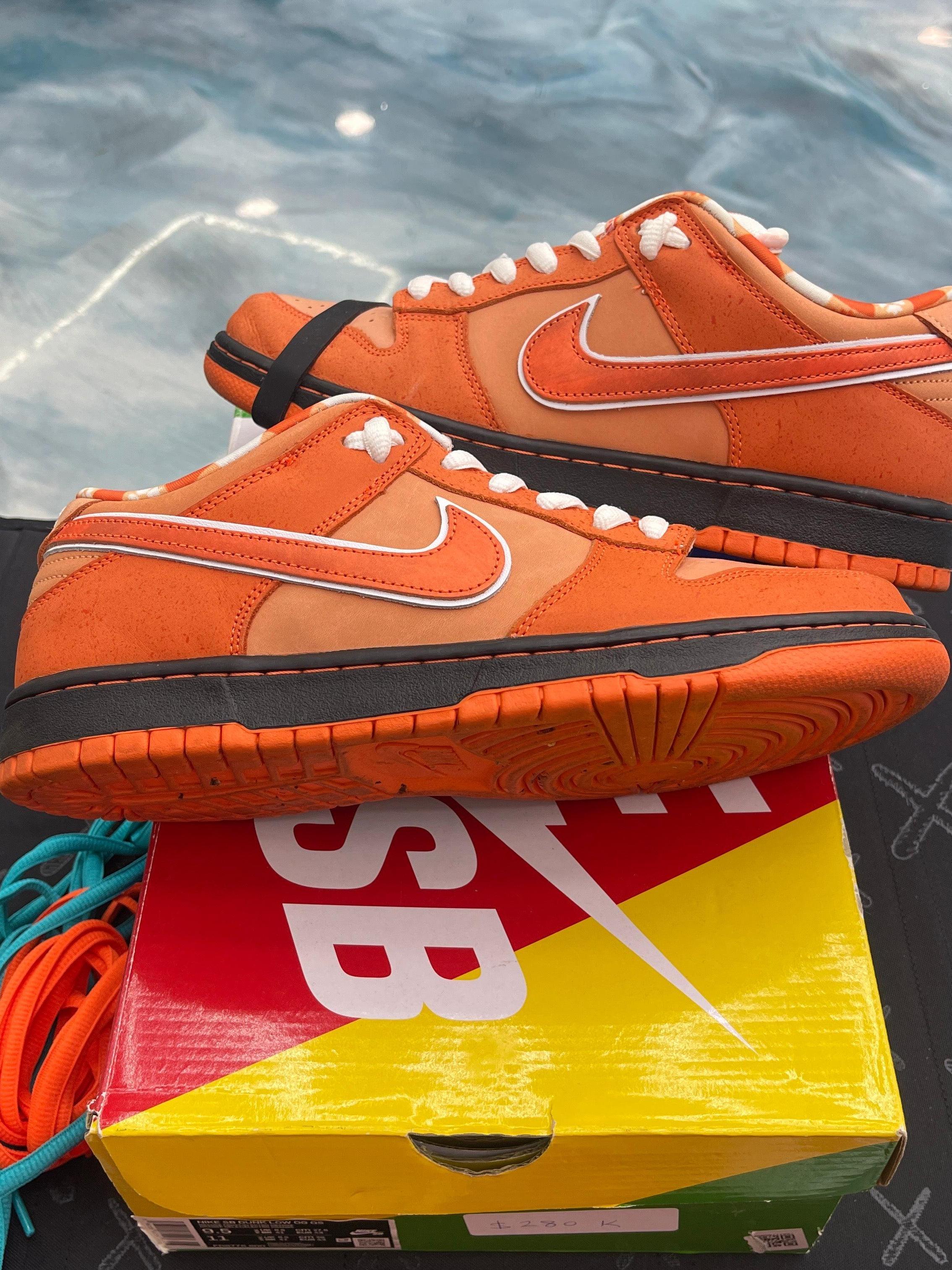 Pre-owned Nike SB Dunk Low Concepts Orange Lobster sneakers, size 9.5, with black midsoles and extra laces.
