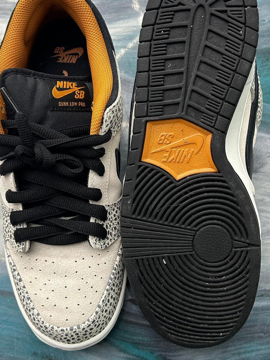 Pre-owned Nike SB Dunk Low Electric Pack Olympic Safari, size 9, with black laces and orange accents.