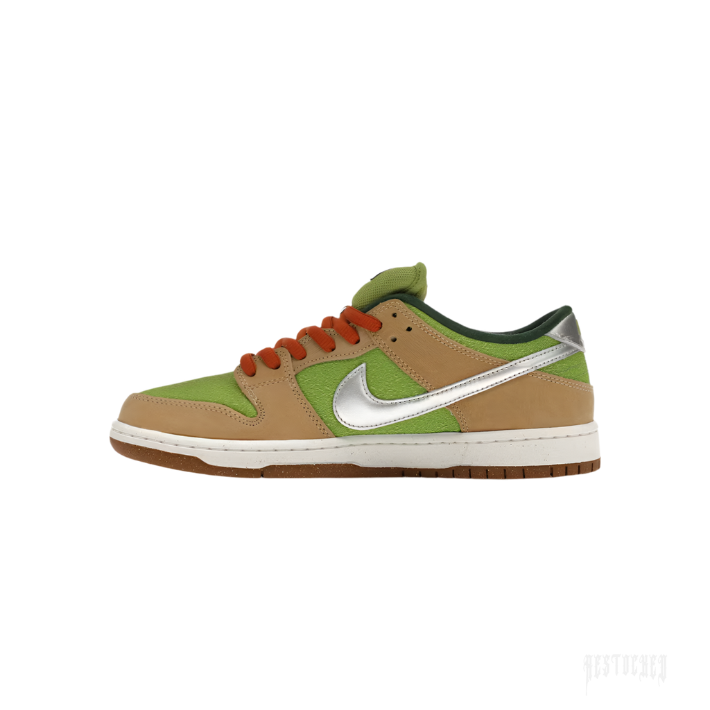 NIKE SB DUNK LOW ESCARGOT sneaker with tan leather, light green suede, metallic silver swoosh, and orange laces.