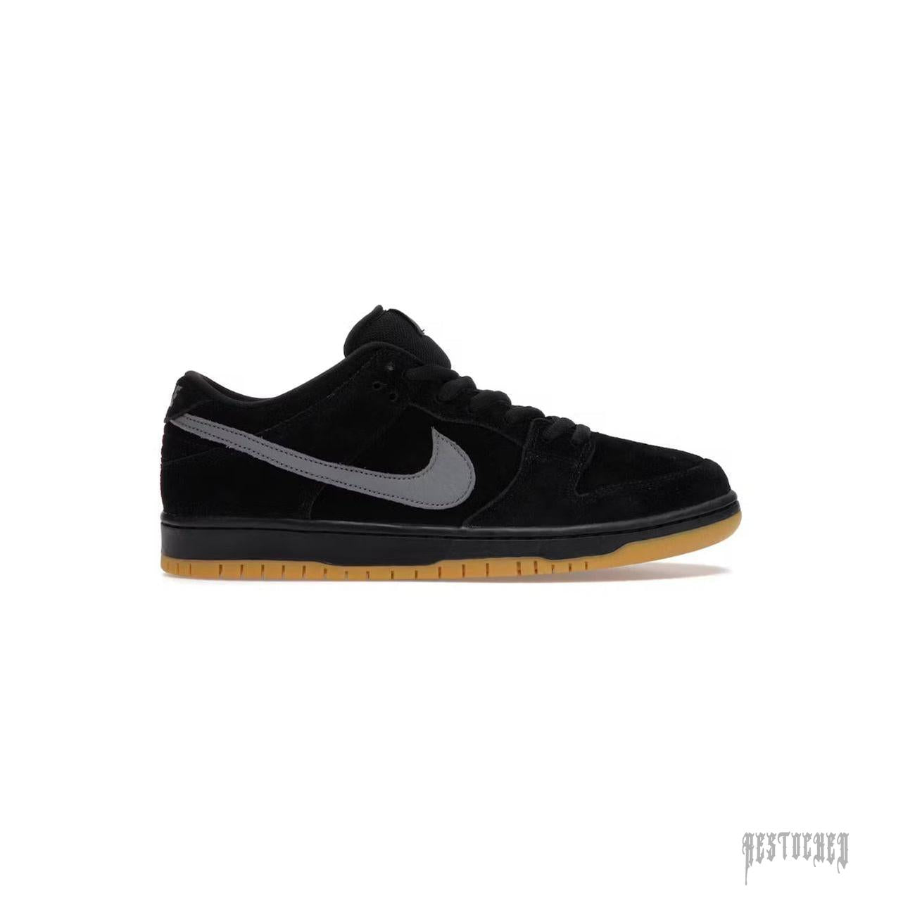 Black suede Nike SB Dunk Low "Fog" sneaker with a grey swoosh and gum sole.