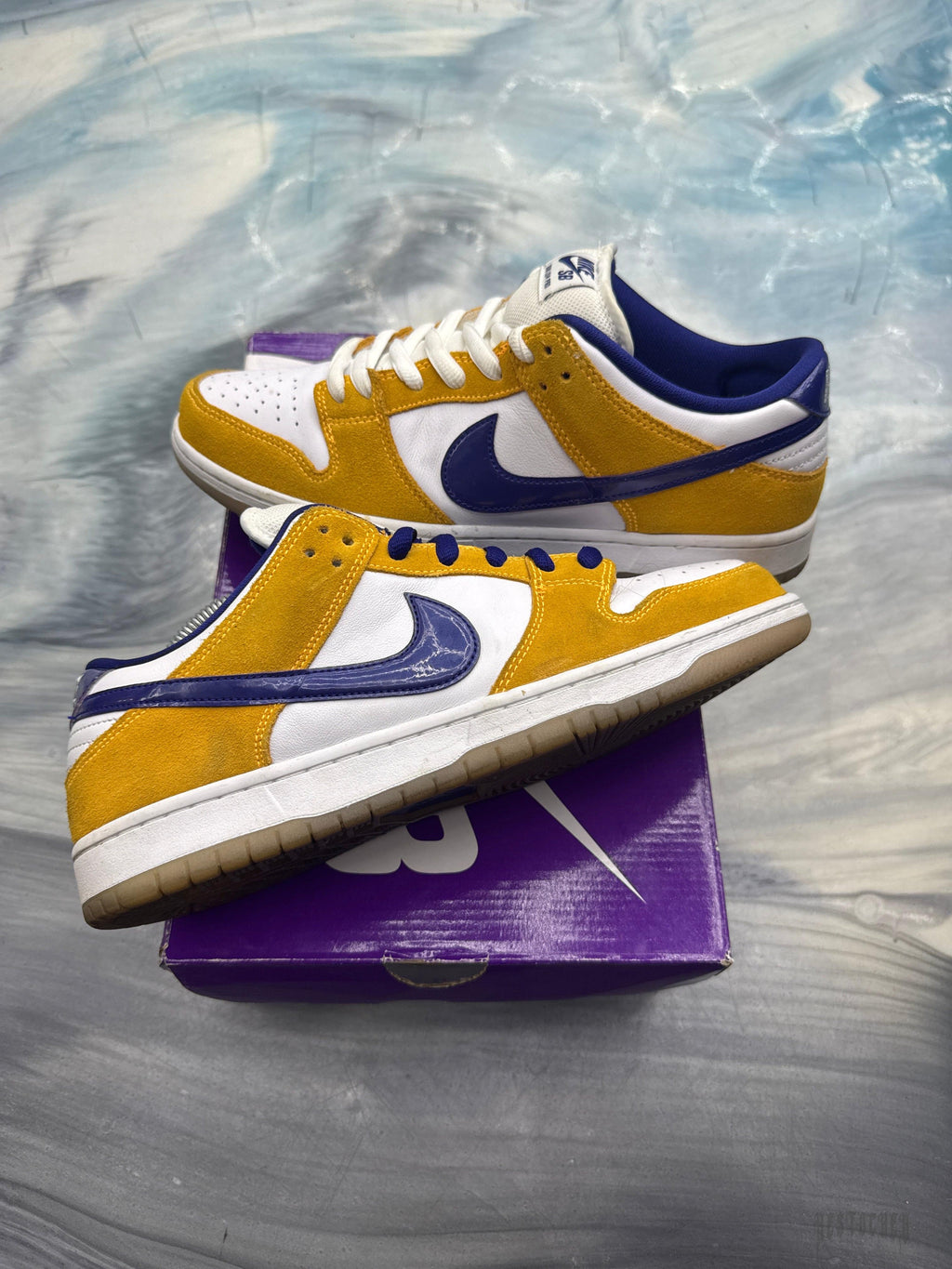 NIKE SB DUNK LOW Laser Orange pre-owned size 10.5 sneakers with white, yellow, and blue accents.