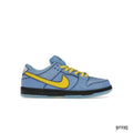 Nike SB Dunk Low "Bubbles" sneaker: light blue upper, yellow swoosh & laces, black sole.